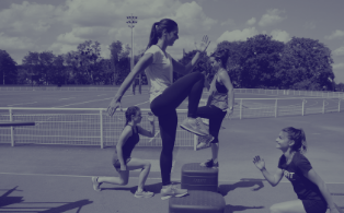 Woman standing on podium exercising